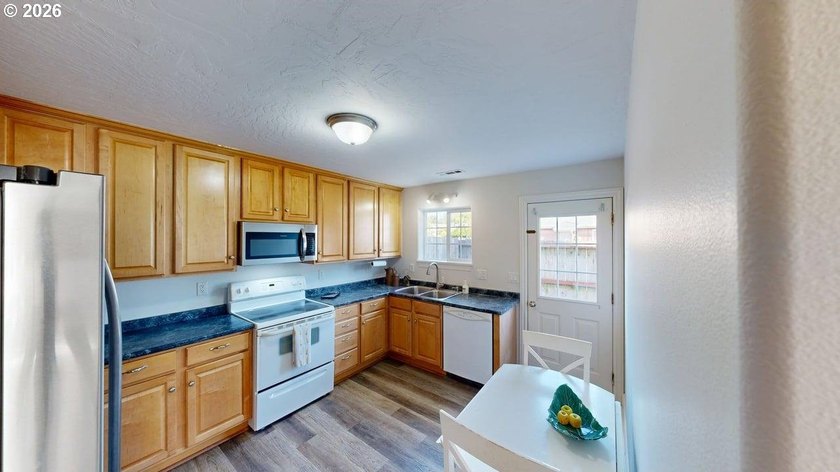 Three bedrooms and a spacious two-level layout set the tone for - photo 8