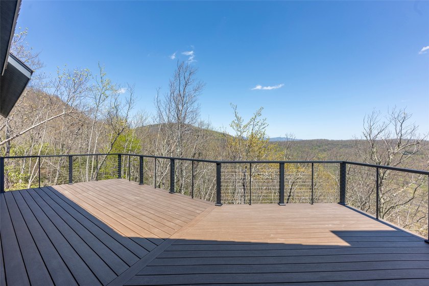 Perched high above Lake Toxaway, this exquisite new-construction - photo 11