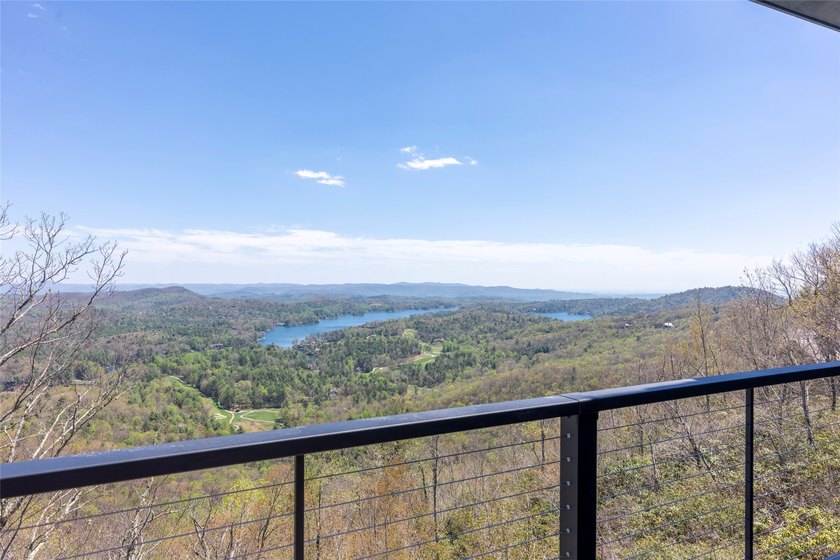 Perched high above Lake Toxaway, this exquisite new-construction - photo 12