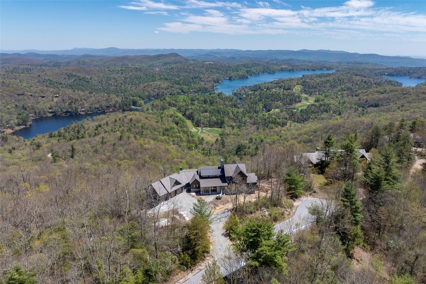 Perched high above Lake Toxaway, this exquisite new-construction - photo 13