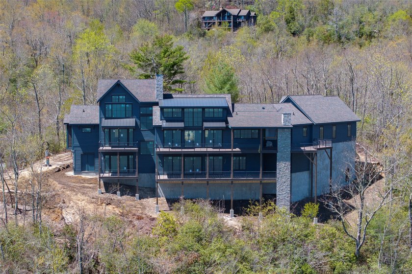 Perched high above Lake Toxaway, this exquisite new-construction - photo 14