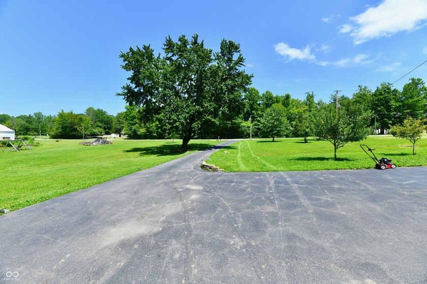 Tucked away on a quiet lot that COMBINES a spacious lawn with a - photo 2