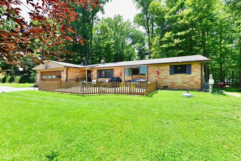 Tucked away on a quiet lot that COMBINES a spacious lawn with a - photo 5