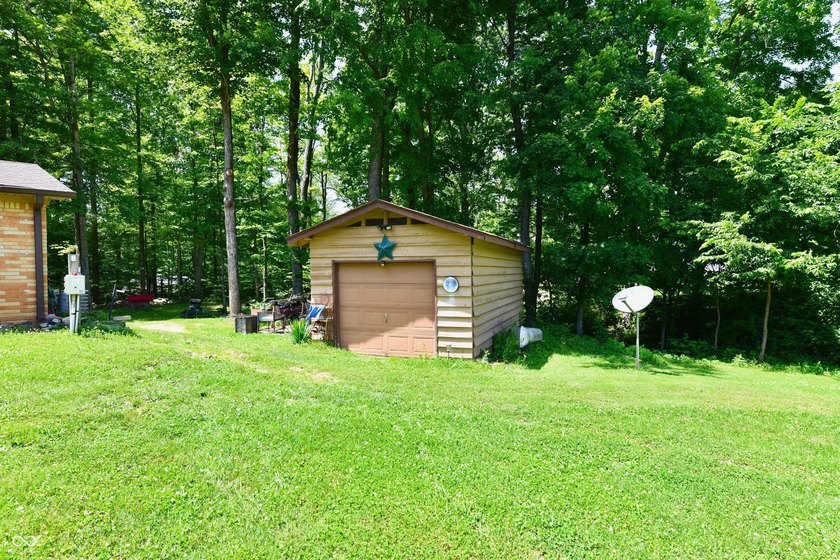 Tucked away on a quiet lot that COMBINES a spacious lawn with a - photo 6
