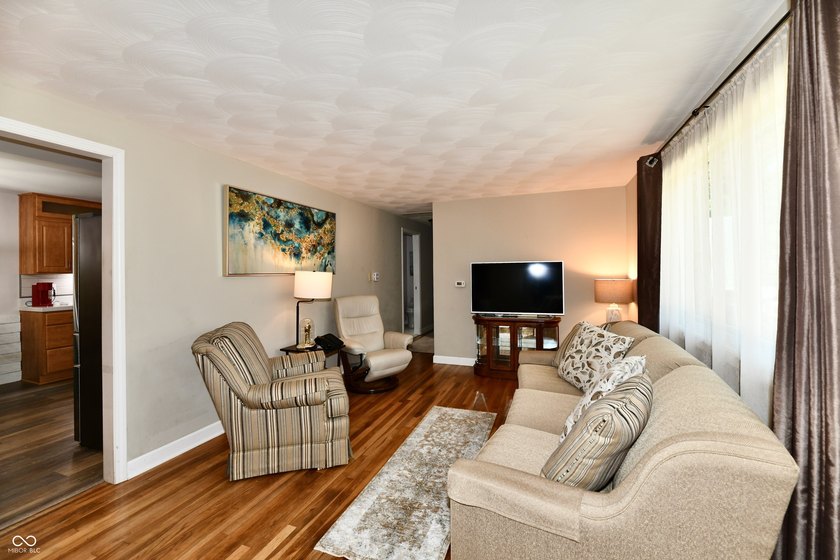 Tucked away on a quiet lot that COMBINES a spacious lawn with a - photo 7