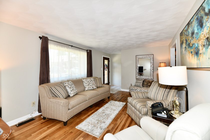 Tucked away on a quiet lot that COMBINES a spacious lawn with a - photo 9