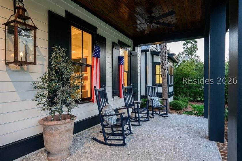 Gracefully positioned on a half-acre homesite overlooking one of - photo 3