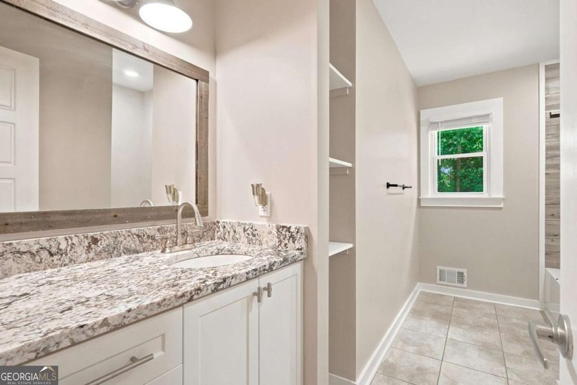 Welcome home to this beautifully renovated 3-bedroom, 2-bathroom - photo 29
