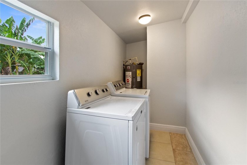 This meticulously renovated property features a new, detached - photo 11