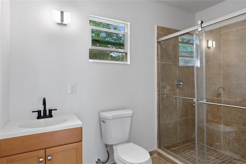 This meticulously renovated property features a new, detached - photo 12