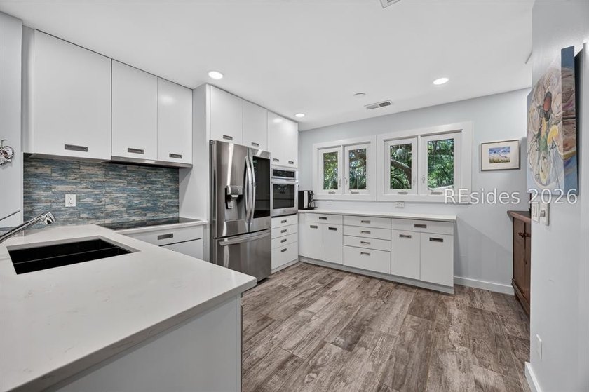 Located in the desirable Windward Village enclave within the - photo 3