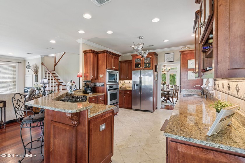 Your coastal oasis awaits! Exceptionally maintained custom-built - photo 14