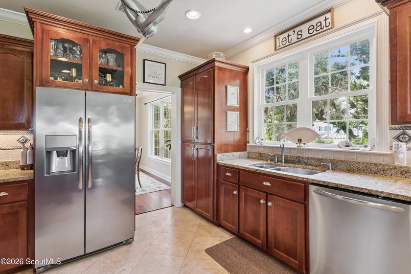 Your coastal oasis awaits! Exceptionally maintained custom-built - photo 20