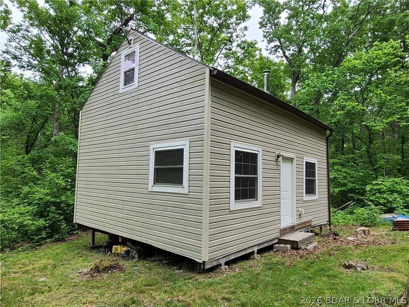 Featuring five acres of wooded privacy and a rustic cabin. Enjoy - photo 32