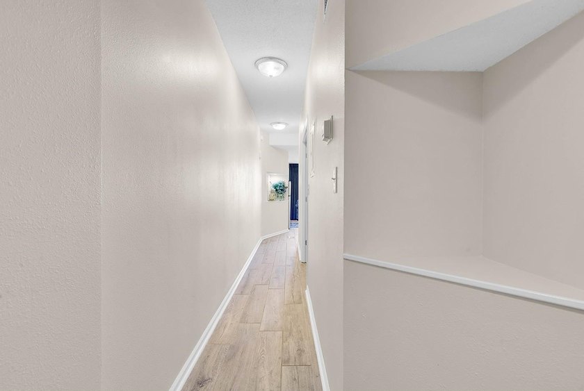Welcome to Unit 207 at Beach Colony Resort, a charming 1-bedroom - photo 3