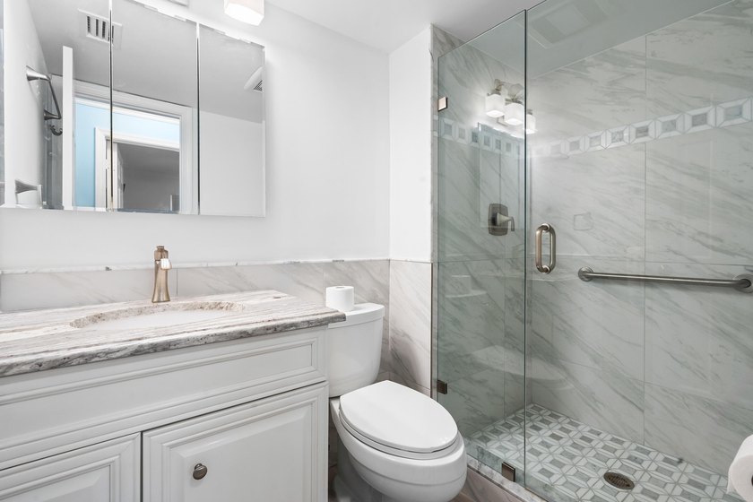 This remodeled condo offers breathtaking views of the turquoise - photo 25