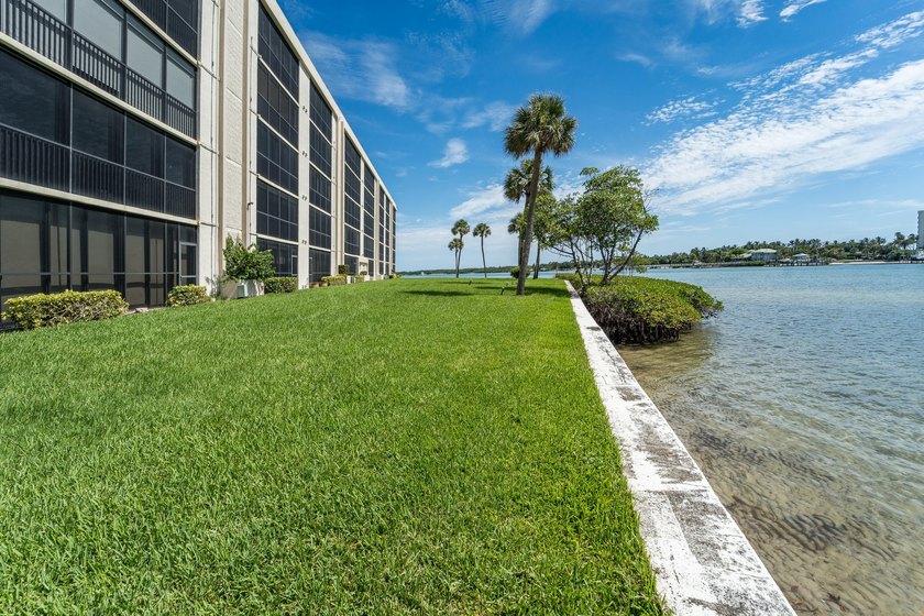 This remodeled condo offers breathtaking views of the turquoise - photo 32