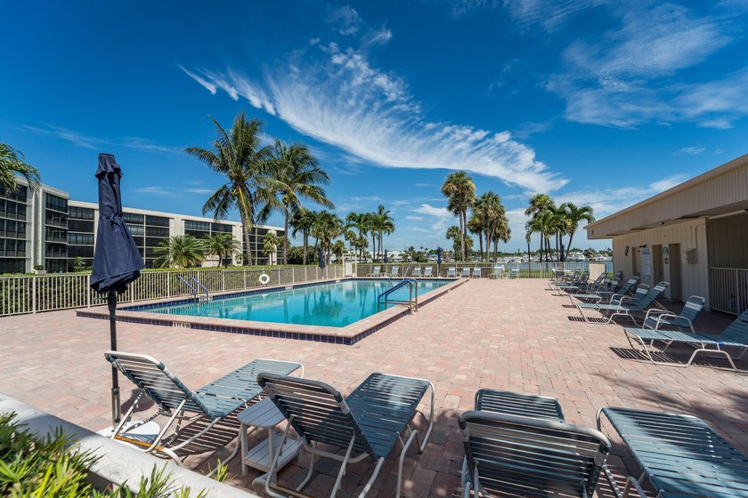 This remodeled condo offers breathtaking views of the turquoise - photo 37