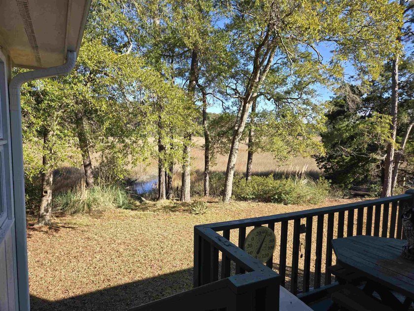 This is a wonderful home that sits on the marsh in Windjammer - photo 6