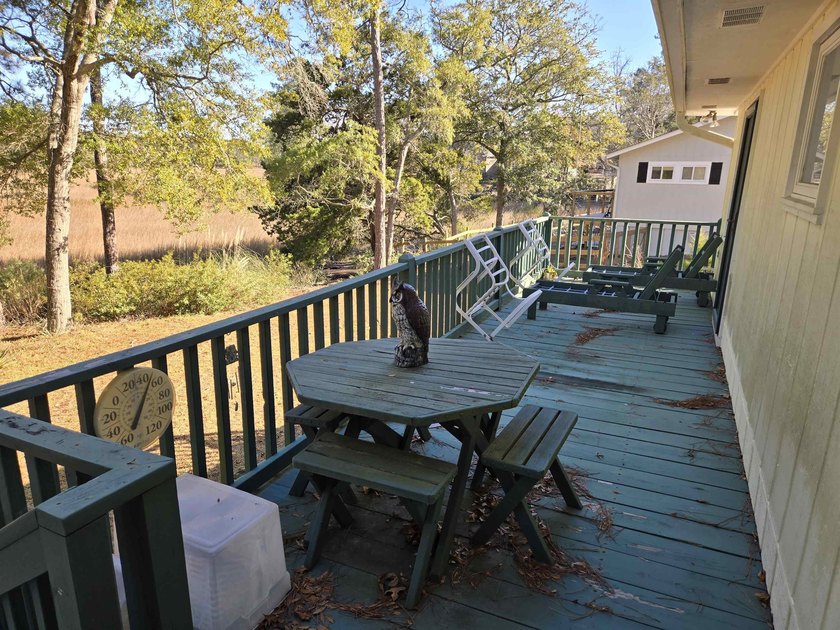 This is a wonderful home that sits on the marsh in Windjammer - photo 7