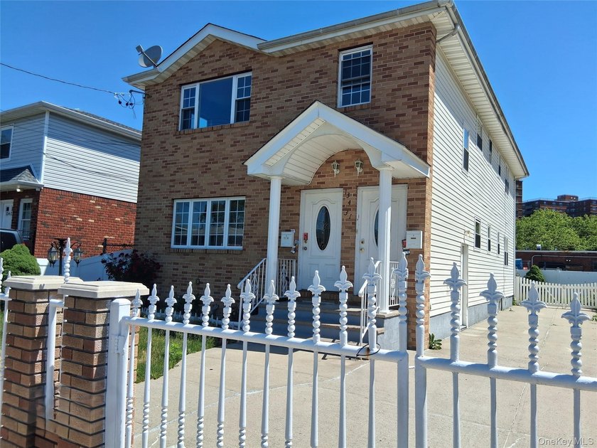 Welcome to this spacious two-family home nestled in the heart of - photo 2