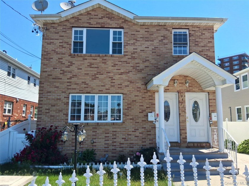 Welcome to this spacious two-family home nestled in the heart of - photo 3