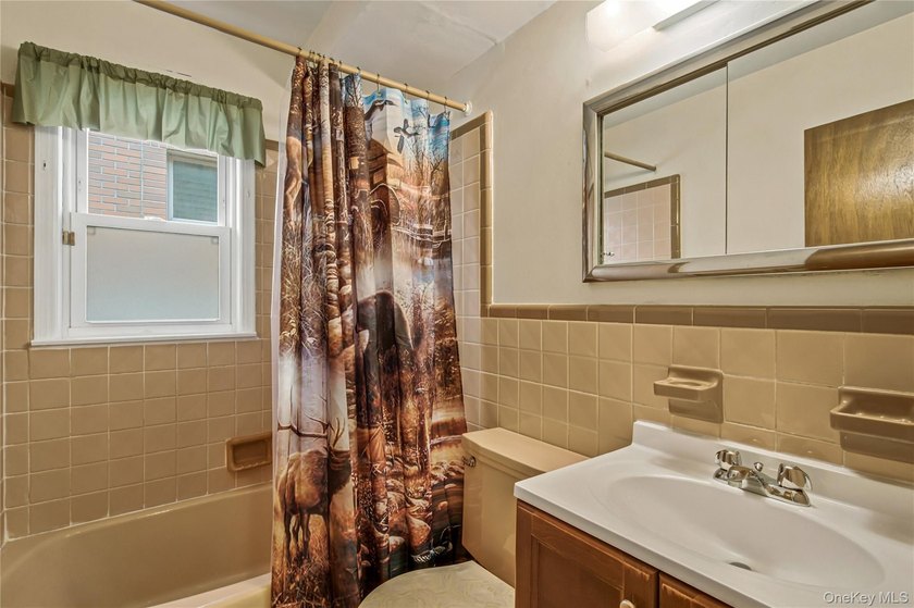 Welcome to this well-maintained two-family home offering an - photo 10