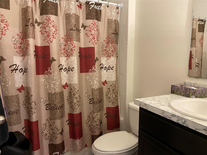 Step into this inviting 3-bedroom, 2-bath home located in the - photo 13