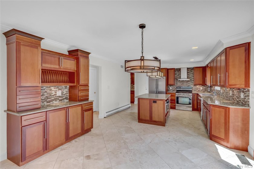 Set on nearly an acre in the heart of Miller Place, this - photo 11