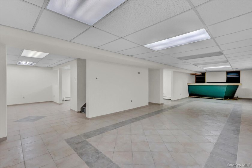 Set on nearly an acre in the heart of Miller Place, this - photo 18