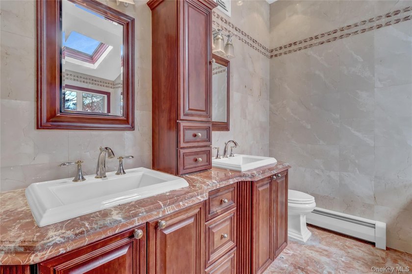 Set on nearly an acre in the heart of Miller Place, this - photo 35