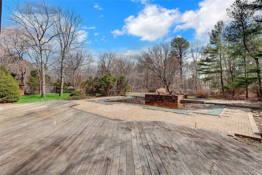 Set on nearly an acre in the heart of Miller Place, this - photo 37