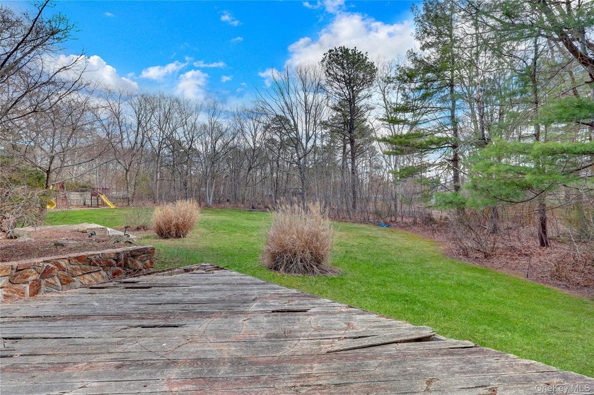 Set on nearly an acre in the heart of Miller Place, this - photo 39