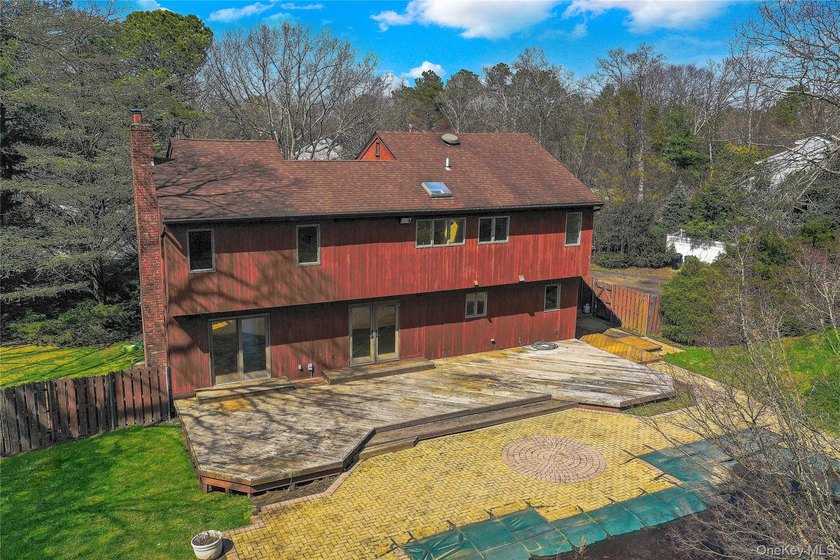 Set on nearly an acre in the heart of Miller Place, this - photo 47