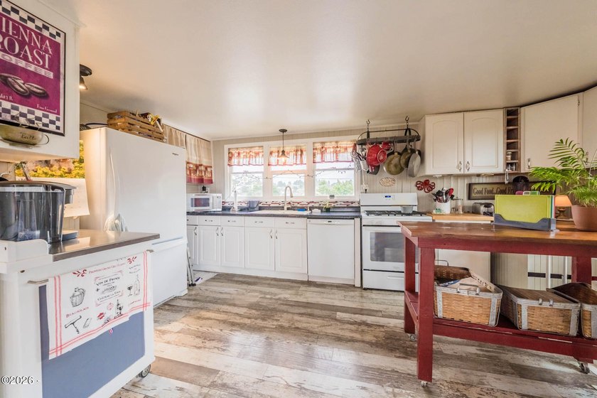 Mid-town beauty with large decks and ocean and surf views from - photo 19