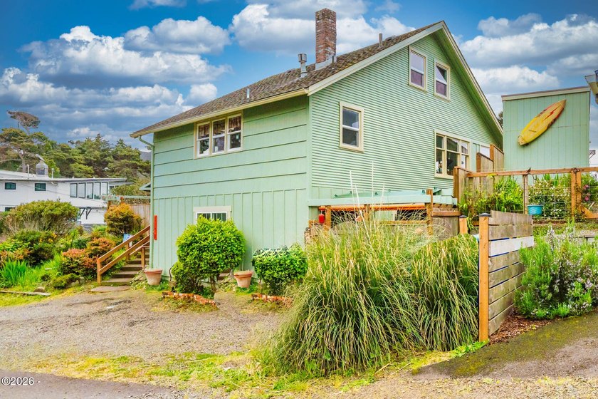 Mid-town beauty with large decks and ocean and surf views from - photo 48