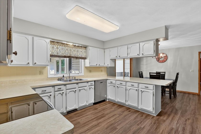 All-brick home offering space and comfort throughout! Features a - photo 12