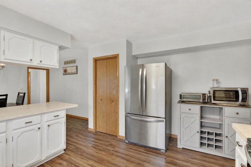 All-brick home offering space and comfort throughout! Features a - photo 13