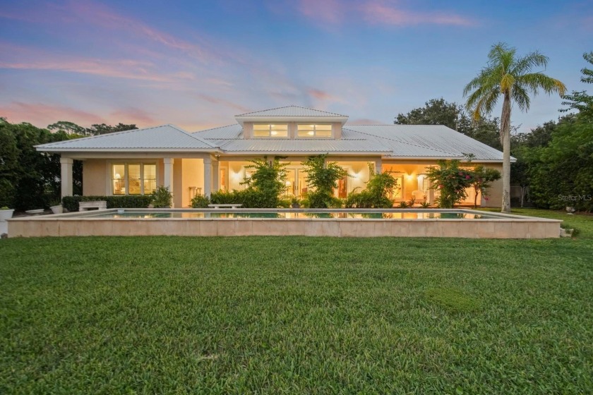 Experience luxurious riverfront living in this striking - photo 8