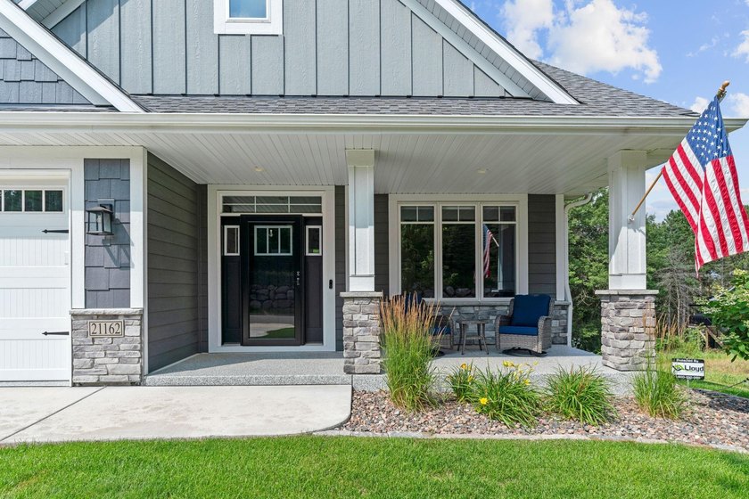 Luxury, low-maintenance living meets peaceful wooded privacy in - photo 2