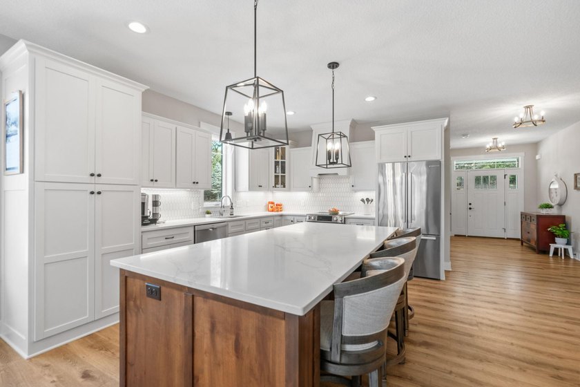 Luxury, low-maintenance living meets peaceful wooded privacy in - photo 3