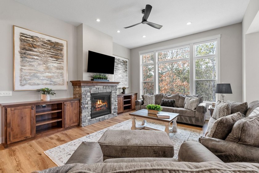 Luxury, low-maintenance living meets peaceful wooded privacy in - photo 4