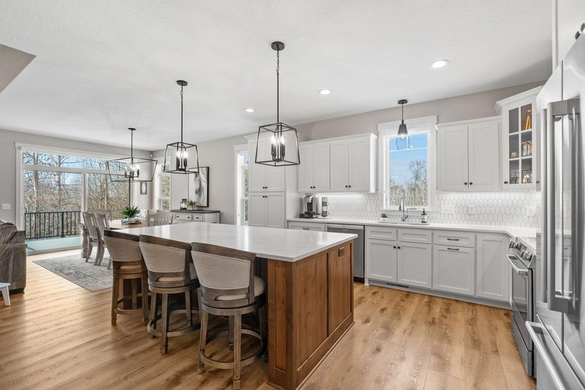 Luxury, low-maintenance living meets peaceful wooded privacy in - photo 8