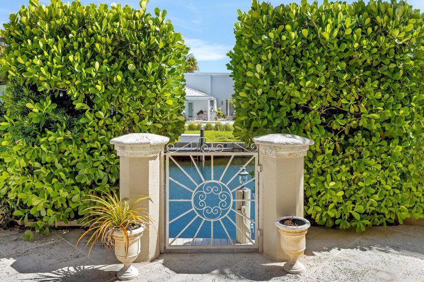 Tucked within the prestigious enclave of Boca Bay Colony, this - photo 19