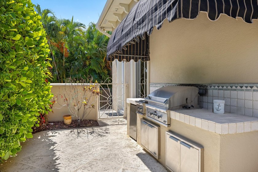 Tucked within the prestigious enclave of Boca Bay Colony, this - photo 23