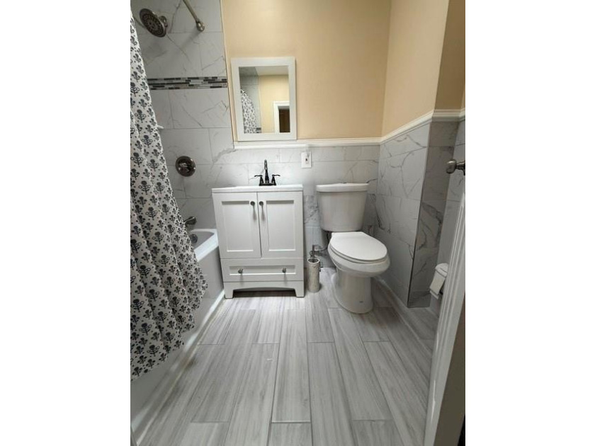 Well-maintained two-family brick home located in the highly - photo 11