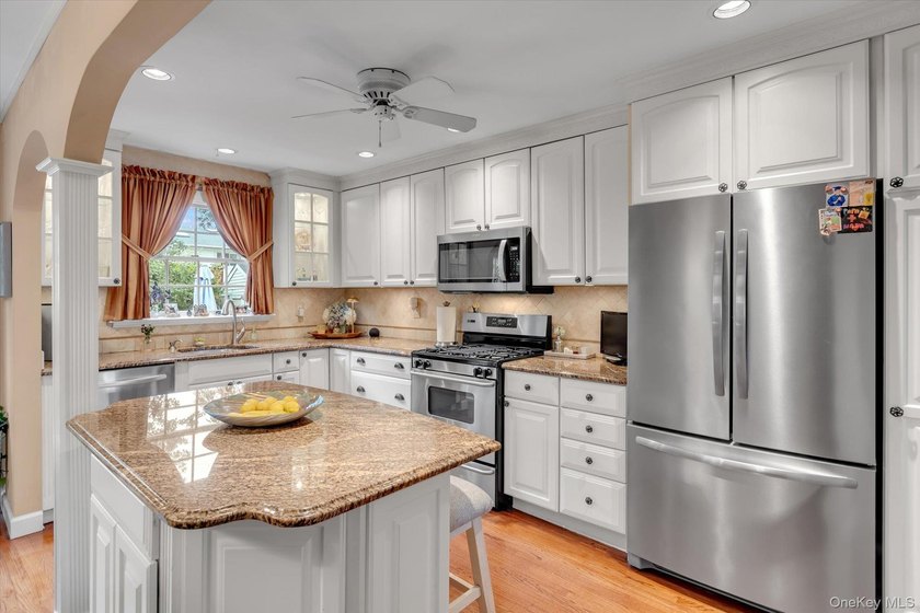 Welcome to this beautifully updated 4-bedroom, 2-bath Cape that - photo 8