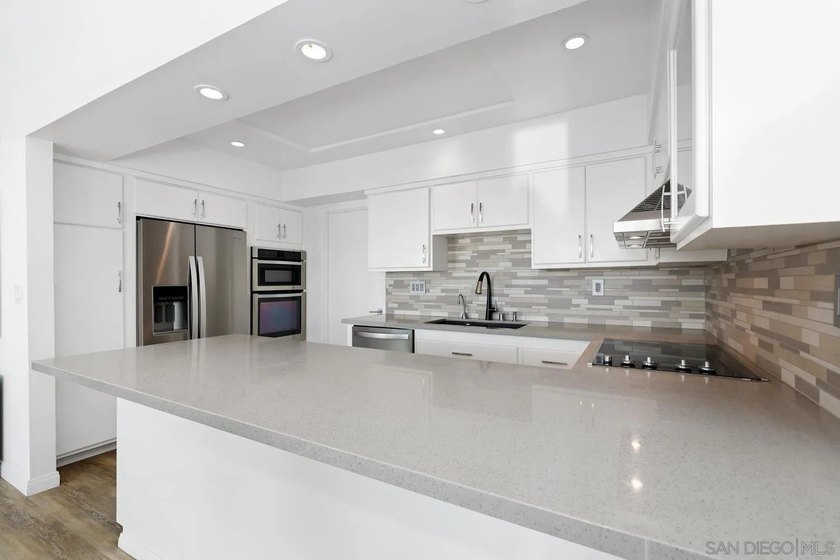 Tucked into the gated enclave of Del Cerro Heights, this fully - photo 9
