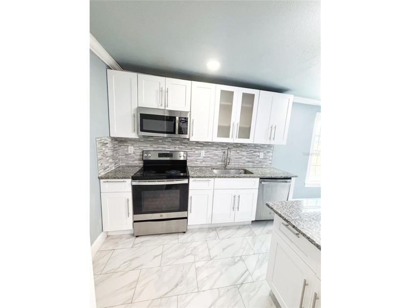 Experience modern luxury in this stunning, fully renovated - photo 28
