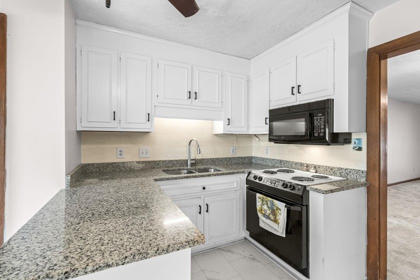 Unit 301 at Spinnaker's Reach is a spacious top-floor condo - photo 12